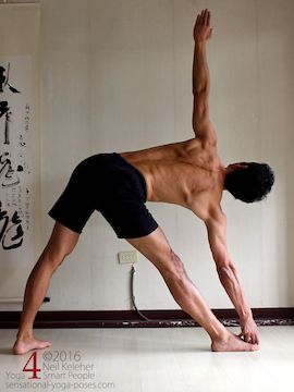 utthita trikonasana (triangle pose), grabbing the big toe and looking up, Neil Keleher, sensational yoga poses