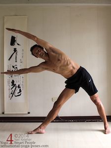 triangle pose with arms lifted and reaching past the head. Neil Keleher. Sensational Yoga Poses.