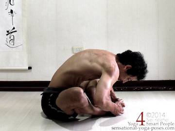 bound angle bent forwards with spine rounded and hands holding feet