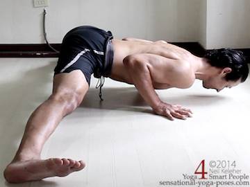 working towards side  splits adductor stretch with hands on the floor in push up position.