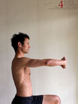 Arm overhead shoulder stretch, hands clasped and palms pressing upwards, neil keleher, sensational yoga poses.