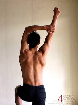 Arm overhead shoulder stretch, pulling one arm to the side, neil keleher, sensational yoga poses.