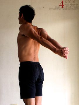 Hands clasped and arms stretching back from down position, neil keleher, sensational yoga poses.