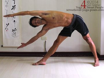 exercises to improve stability: triangle pose with both hands lifted.