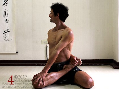 Low back stretches: bharadvajasana or seated twist with a behind the back attempted foot grab using the free hand as an intermediary. Neil Keleher, sensational Yoga poses.