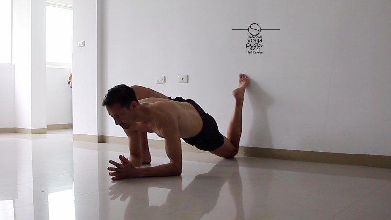 quad stretch using a wall, low lunge variation with elbows on floor Neil Keleher, Sensational Yoga Poses.