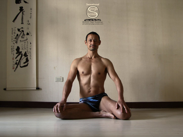 half hero quad stretch variation with both knees bent Neil Keleher, Sensational Yoga Poses.