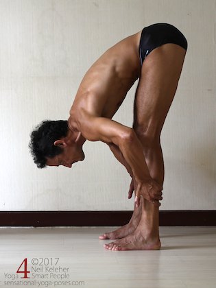 Arm strengthening standing forward bend: Grabbing your shins and pulling forwards.  Neil Keleher. Sensational Yoga Poses.