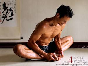 Bending forwards in bound angle pose.