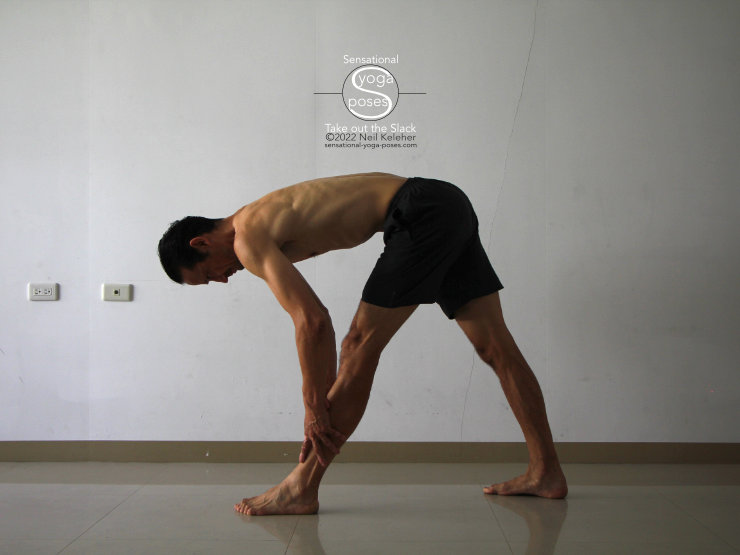 pyramid pose standing forward bend with hands on front shin. Neil Keleher. Sensational Yoga Poses.