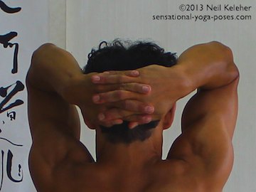 headstand preparation, fingers interlased palms open