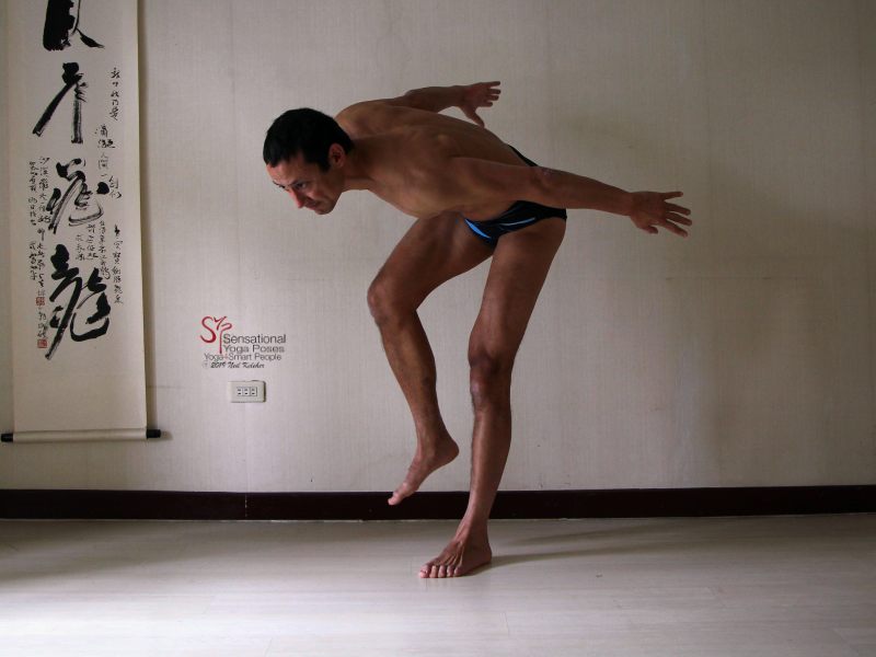 Forward bending hip lift, hip lifted. Neil Keleher, Sensational Yoga Poses.