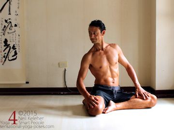 bharadvajasana variation, seated side bend.