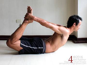 Hip flexor stretches. Bow yoga pose hip flexor stretch with both ankles grabbed and eyes looking straight ahead. Legs work against the arms so that this is an active and resisted hip flexor stretch.Neil Keleher, sensational yoga poses.