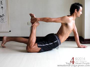 half bow yoga pose variation same side hand grabbing one ankle. 