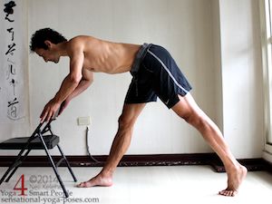 hamstring stretches using a chair for support.