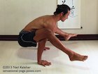 tittibasana arm balance, feet lifted knees bent