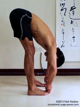 Grabbing the Big toes in a standing forward bend. Neil Keleher. Sensational Yoga Poses.