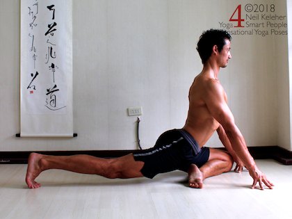 yoga for flexibility, stretching the front of the hip with upright pigeon. Back knee is lifted with toes tucked under, pelvis is level from left to right, torso is upright with lumbar and thoracic spine bent backwads. Neil Keleher. Sensational Yoga Poses