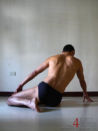 Working towards a lying quadriceps stretch with a modified single leg kneelng position. Neil Keleher. Sensational Yoga Poses.