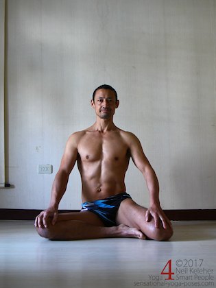 half hero quad stretch variation with both knees bent Neil Keleher, Sensational Yoga Poses.
