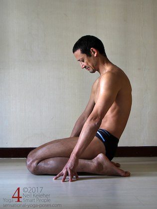 Kneeling with hips between feet (virasana yoga pose) with back bend forwards. Neil Keleher. Sensational Yoga Poses.