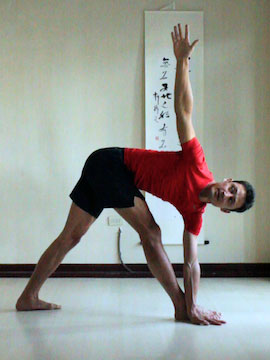 revolving triangle (parivrtta trikonasana) with bottom hand outside foot.