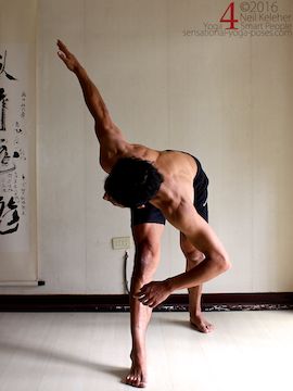 Revolved triangle, using the arm to help the twist, neil keleher, sensational yoga poses.