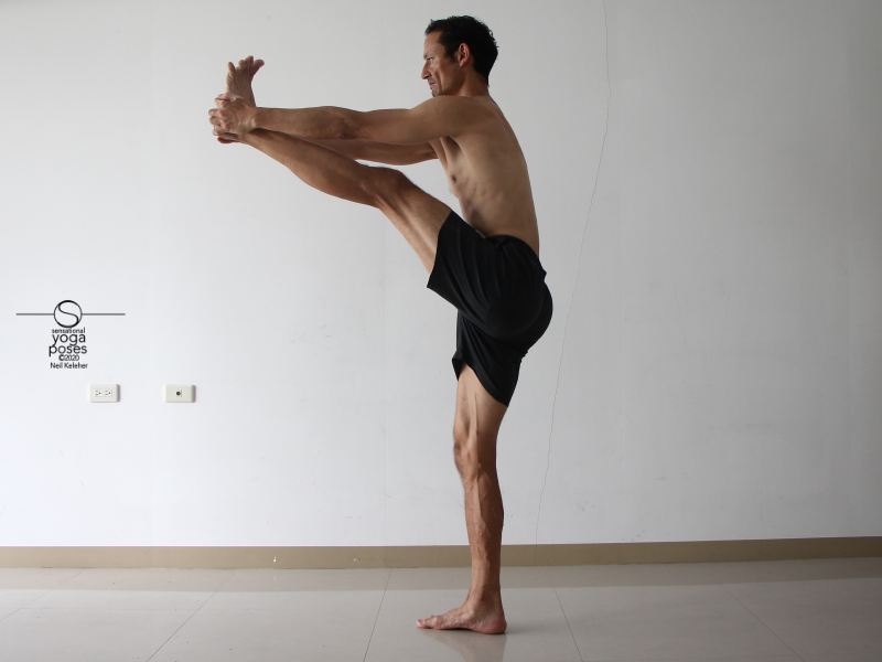 Grabbing a foot while standing to stretch the hamst. Neil Keleher, Sensational Yoga Poses.