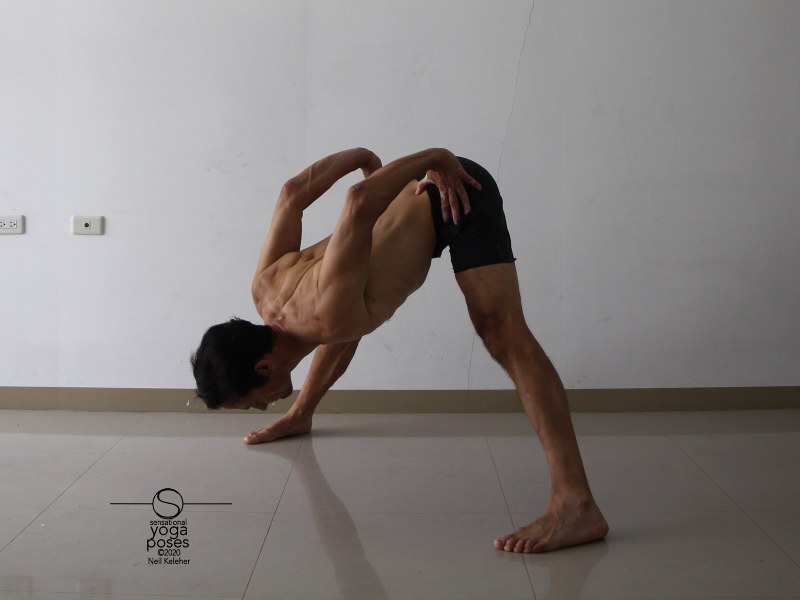 wide leg standing hamstring stretch with hands on waist (prasaritta padotanasana B). Bending forwards, keep your chest open and shoulder blades retracted. Try lifting your sitting bones or pulling down on your ASICs to stretch your hamstrings. Neil Keleher, Sensational Yoga Poses.