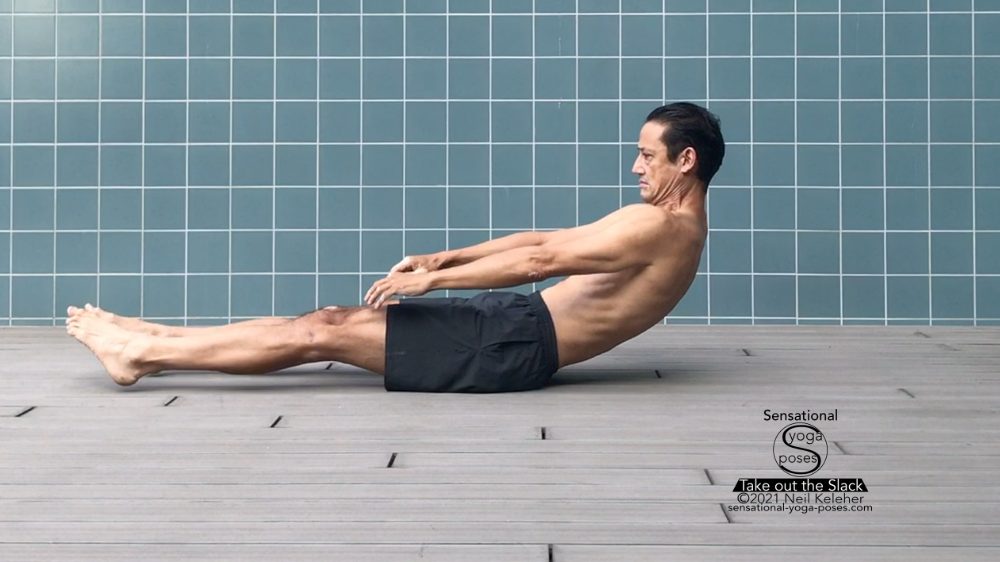 Young serene man in sportswear crossing legs while sitting in pose of lotus  Stock Photo by Pressmaster