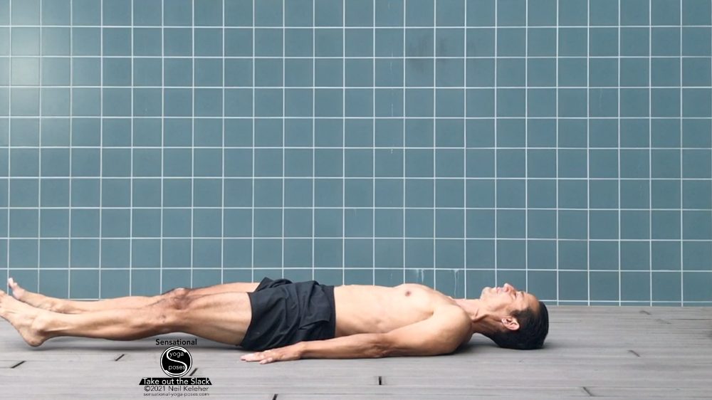 supine leg lift bottom position, legs close to the ground but not resting. Neil Keleher, Sensational Yoga Poses.