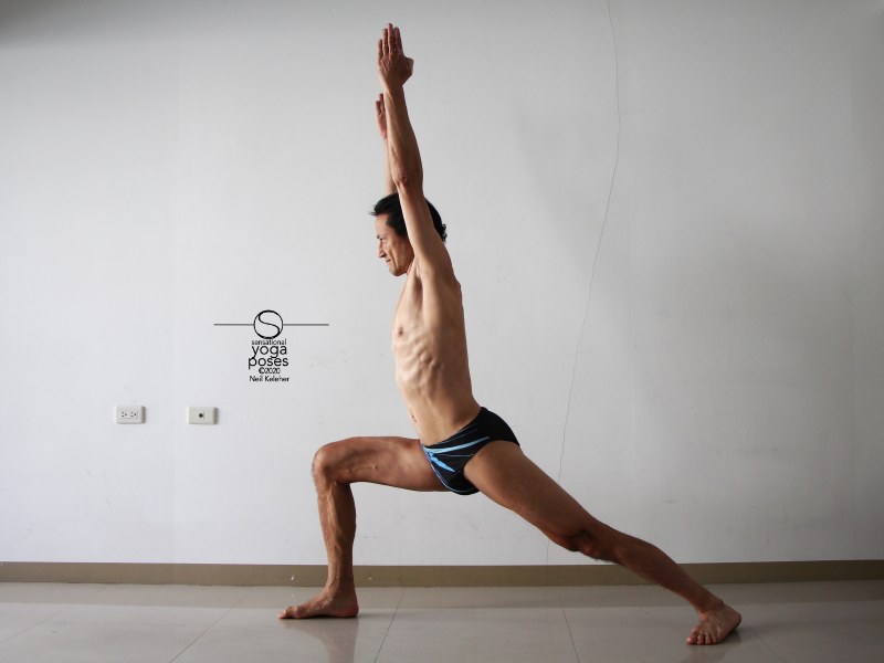 warrior 1 yoga pose with arms up. Neil Keleher. Sensational Yoga Poses.
